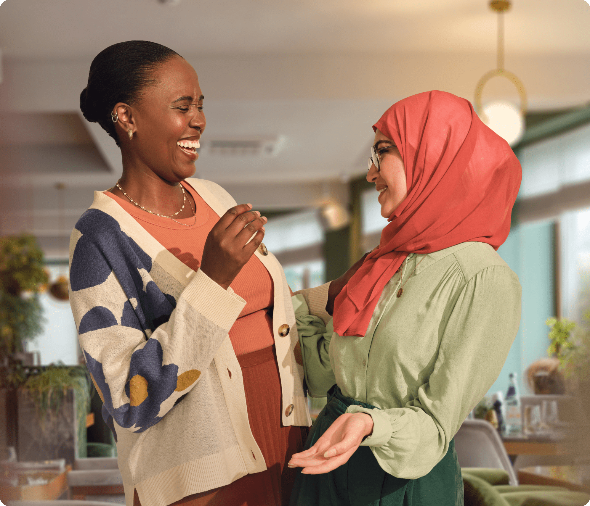 Image of two women talking.