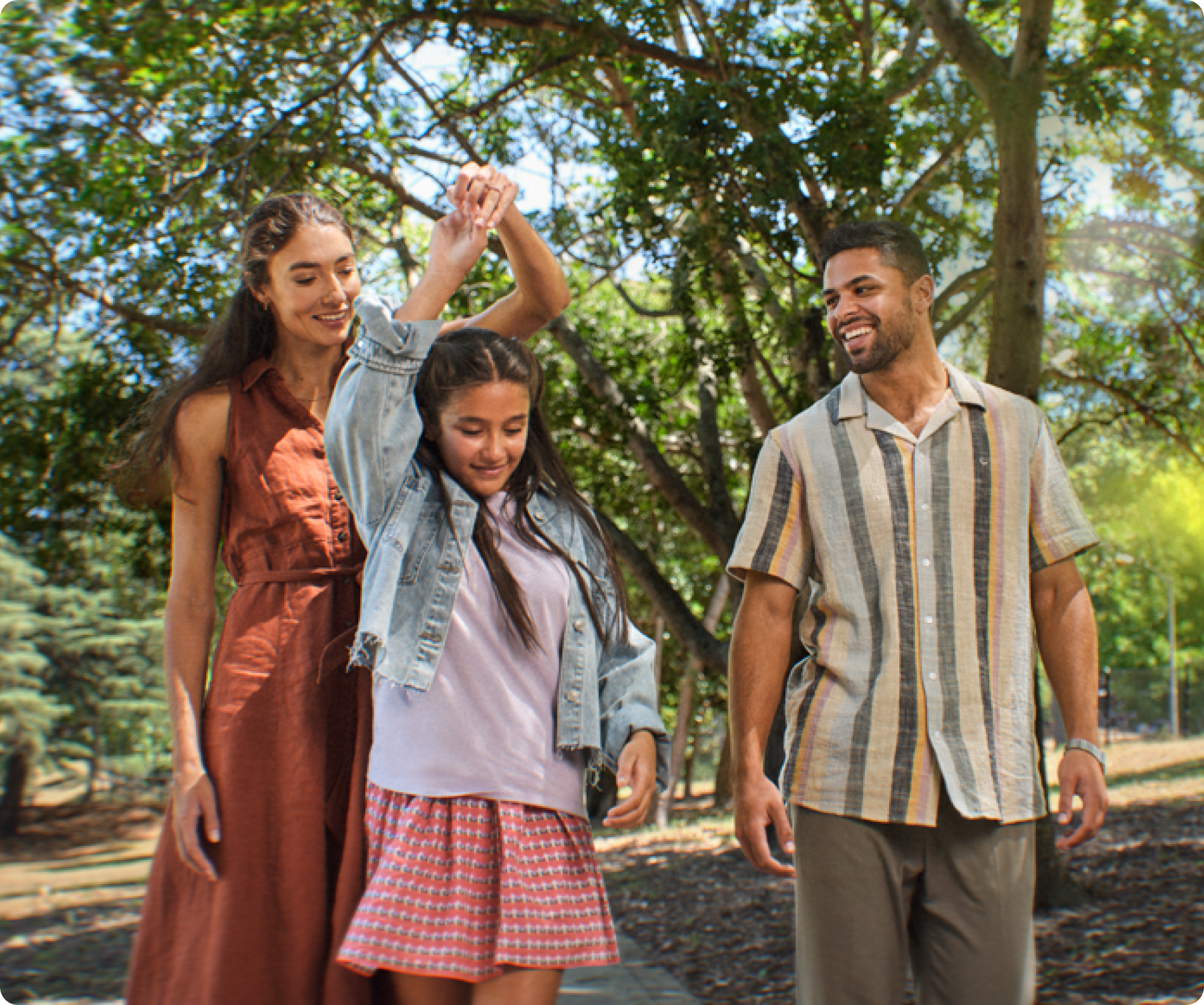 Image of a family walking together outdoors.